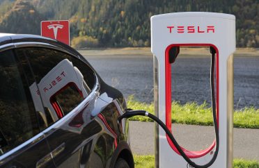 Tesla Model X (electric vehicle) charging at a Tesla supercharger